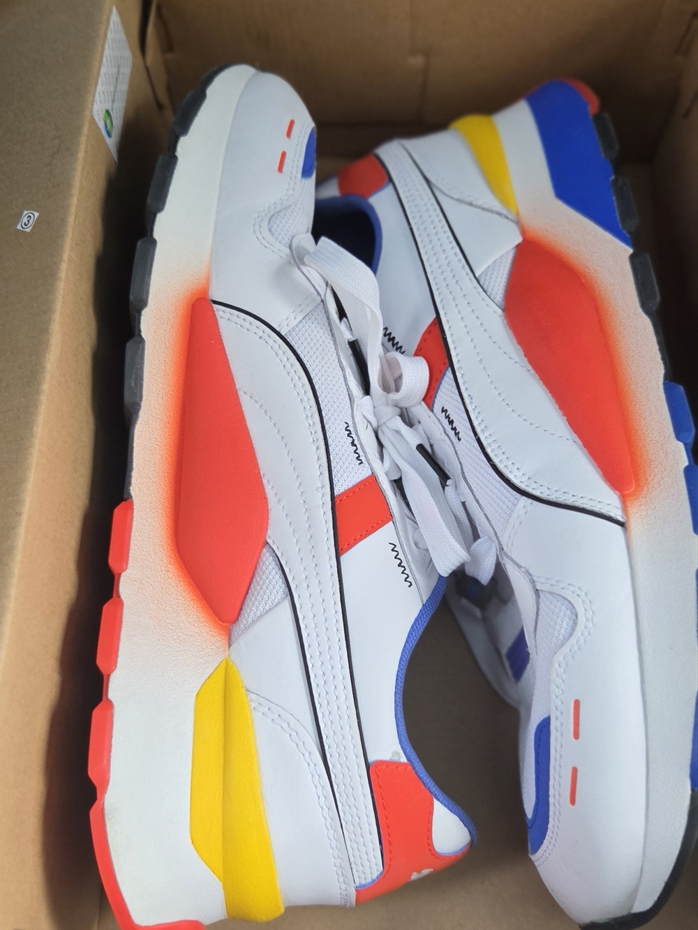 Puma White Runner Sneakers with Red, Yellow & Blue Accents